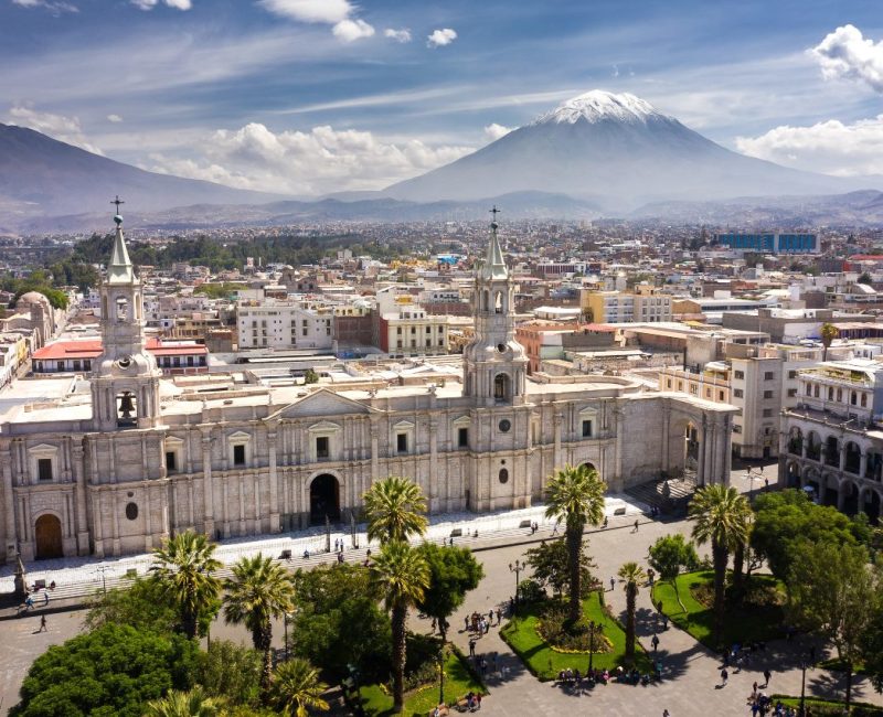 Aerial drone view of Arequipa main square and cathedral church, with the Misti volcano as background.
